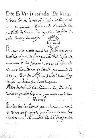 Este es vn traslado de vna de vna carta de nuestro Señor el Rey escrita en pergamino E firmadad Esellada con su sello de cera en sus espaldas con filos de seda verde y vermeja